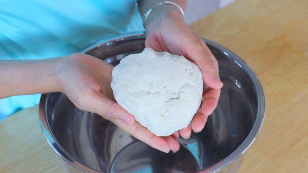 Knead the dough into a rough ball; it will feel tough. (CiCi Li)
