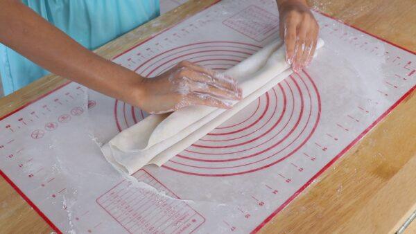 Accordion-fold the dough sheet. (CiCi Li)