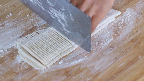 Slice the folded dough into strips. (CiCi Li)
