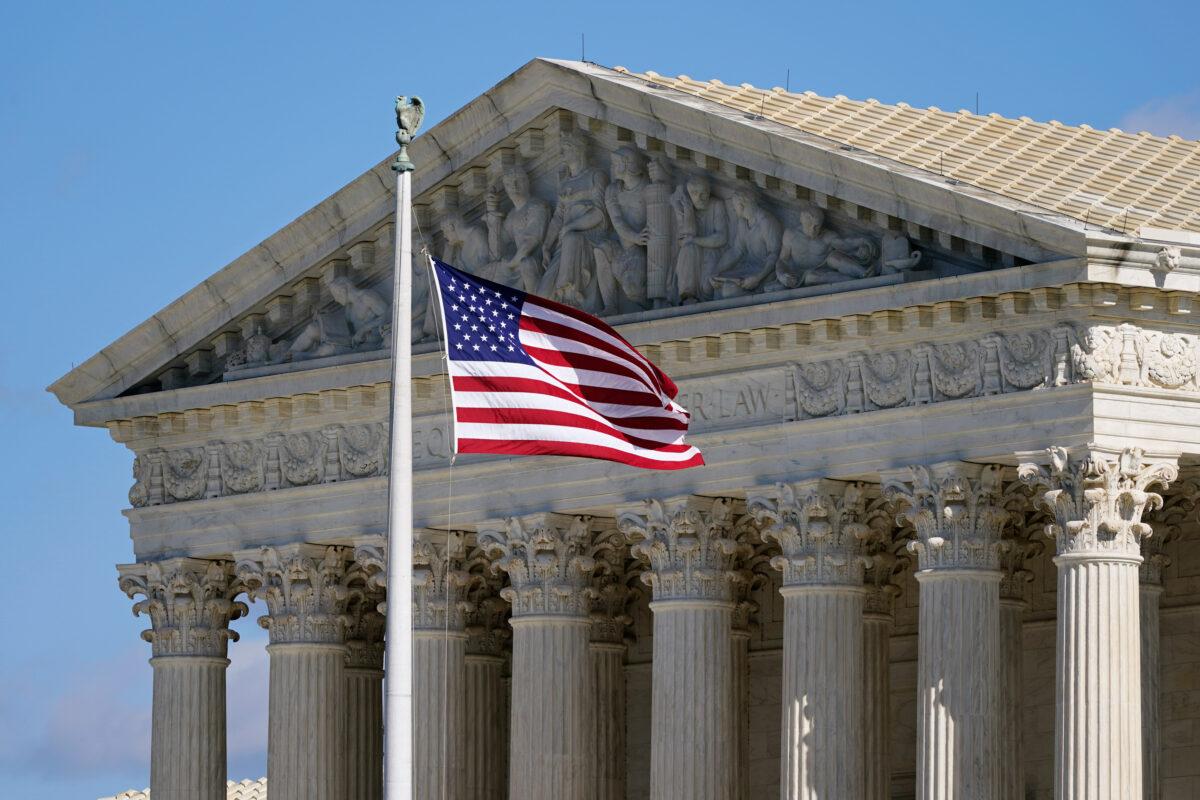 An American flag waves in front of the Supreme Court building on Capitol Hill in Washington on Nov. 2, 2020. (Patrick Semansky/AP Photo)