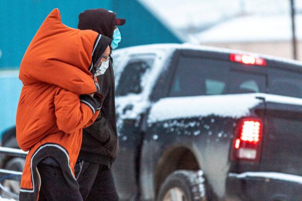 People wear masks to help slow the spread of coronavirus disease (COVID-19) as the territory of Nunavut enters a two week mandatory restriction period in Iqaluit, Nunavut, Canada on November 18, 2020. (Reuters/Natalie Maerzluft/File Photo)