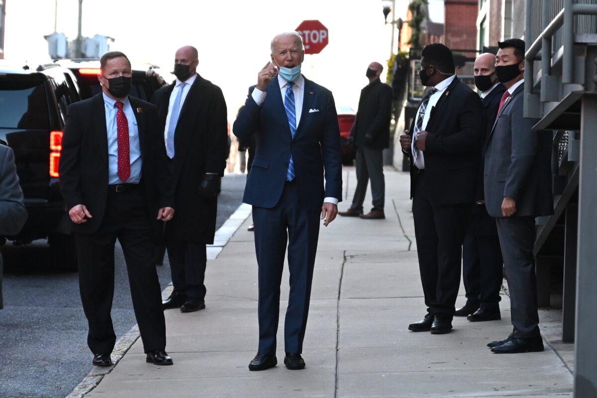 Democratic presidential candidate Joe Biden speaks to reporters after exiting The Queen theater in Wilmington, Del., on Dec. 7, 2020. (Jim Watson/AFP via Getty Images)