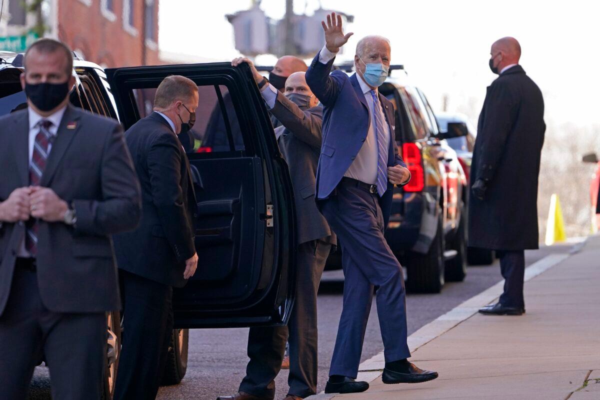 Democratic presidential candidate Joe Biden waves as he arrives at The Queen theater in Wilmington, Del., on Dec. 7, 2020. (Susan Walsh/AP Photo)