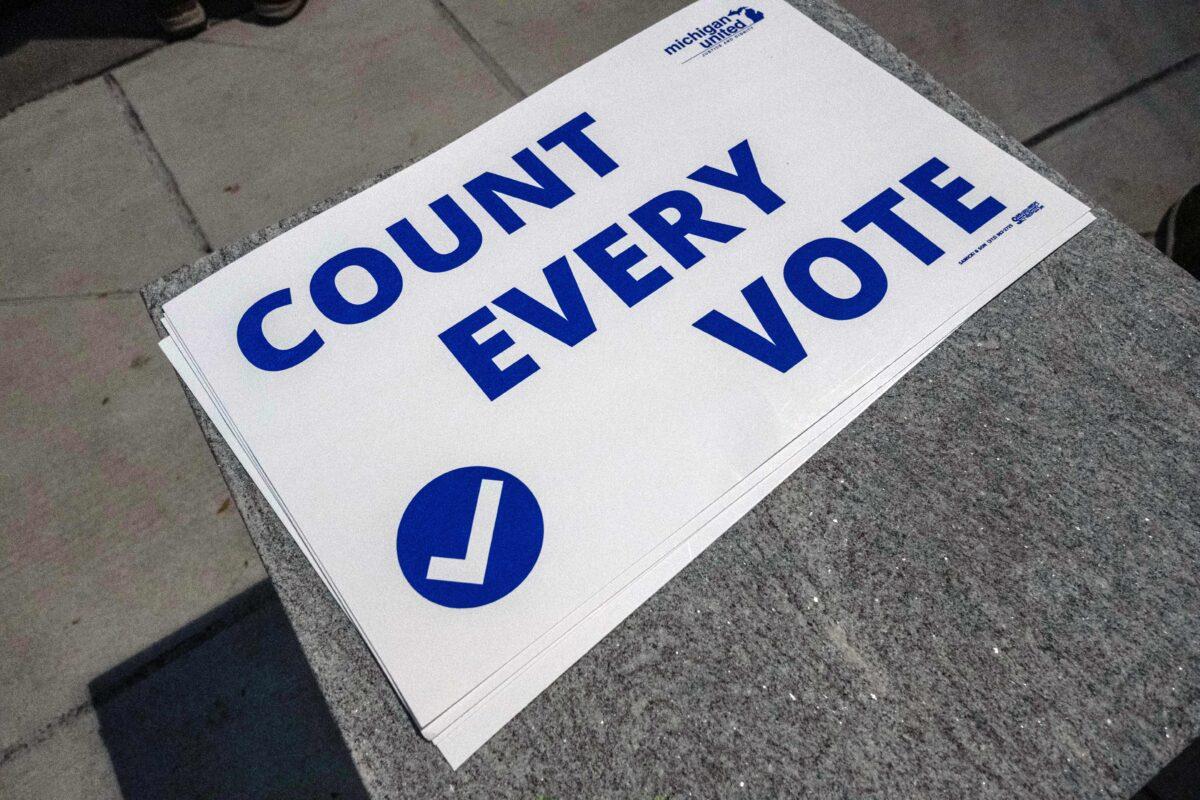  A "Count every vote" sign lays outside of the TCF center where ballots are being counted in downtown Detroit, Mich., on Nov. 4, 2020. (Seth Herald/AFP via Getty Images)