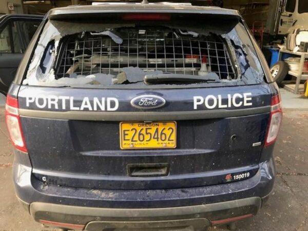 The rear window of a Portland Police Department patrol vehicle that was damaged during unrest on North Mississippi Avenue in Portland, Ore., on Dec. 8, 2020. (Courtesy of Portland Police Bureau)