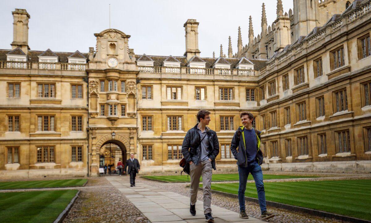 Students walk through Cambridge University in Cambridge, England, on March 14, 2018. (Tolga Akmen/AFP via Getty Images)