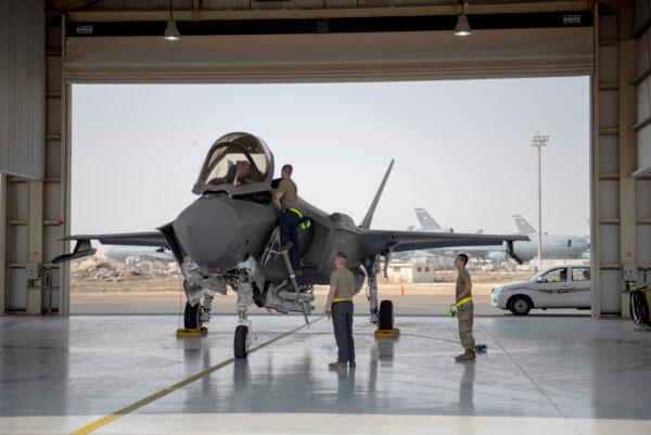 An F-35 fighter jet pilot and crew prepare for a mission at Al-Dhafra Air Base in the United Arab Emirates on Aug. 5, 2019. (Staff Sgt. Chris Thornbury/U.S. Air Force via AP)