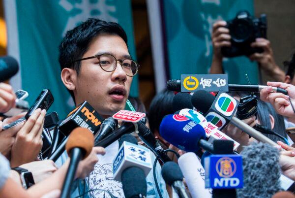 Pro-democracy activist Nathan Law speaks to the media outside the Court of Final Appeal after his bail application was successful at Hong Kong's highest court on Oct. 24, 2017. Law was released from jail on bail pending an appeal against conviction for his role in the 2014 Umbrella Movement protests. (Isaac Lawrence/AFP via Getty Images)