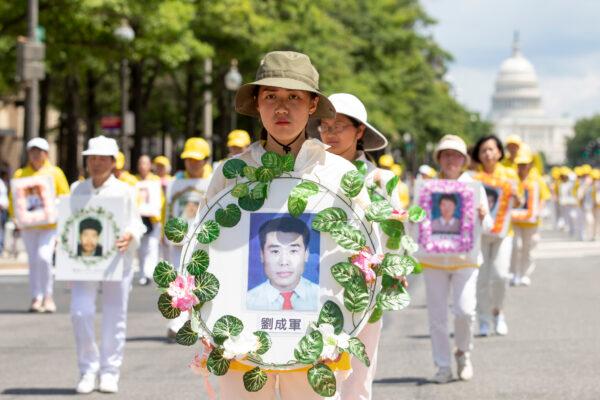 Falun Gong practitioners take part in a parade commemorating the 20th anniversary of the persecution campaign against the group in China, in Washington on July 18, 2019. (Samira Bouaou/The Epoch Times)