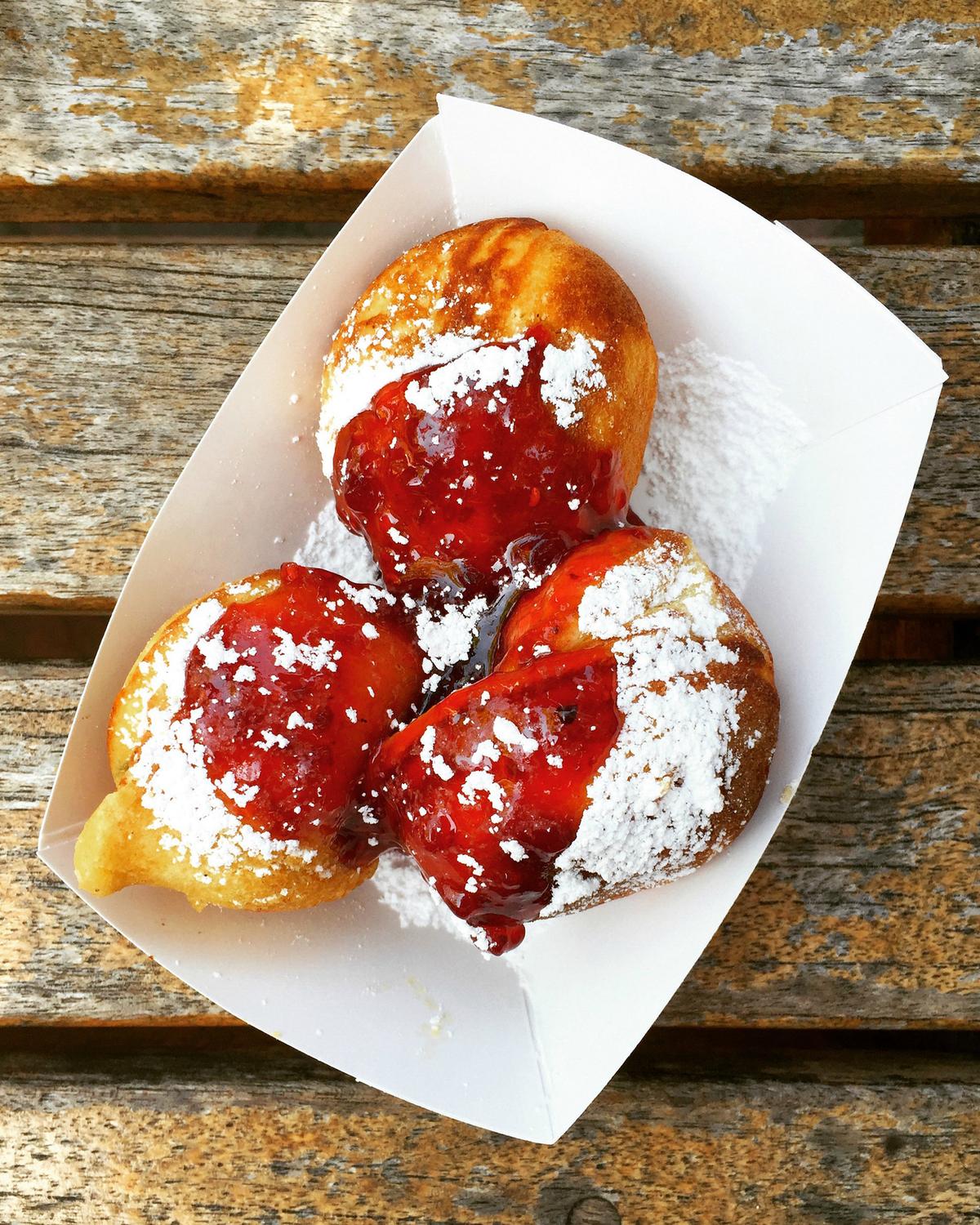 Aebleskivers with powdered sugar and raspberry preserves. (Lynda Balslev for Tastefood)