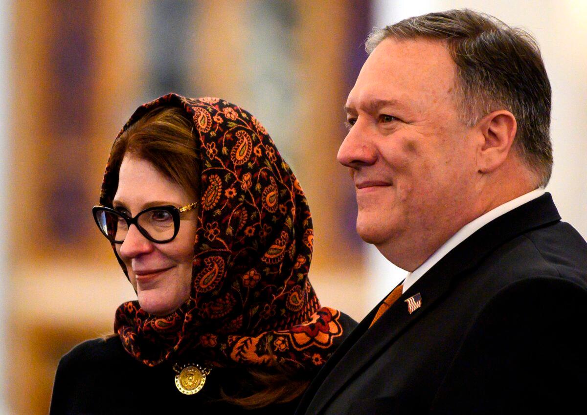 Then-U.S. Secretary of State Mike Pompeo (R) and his wife Susan pose for a photo as they take a tour of the newly-inaugrated Al-Fattah Al-Alim mosque in Egypt's New Administrative Capital, east of Cairo, Egypt, on Jan. 10, 2019. (Andrew Caballero-Reynolds/AFP via Getty Images)