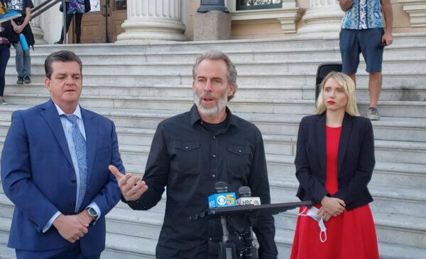 Attorney Robert Tyler (L), Pastor Mike McClure (C), and co-counsel Mariah Gondeiro at a public conference regarding McClure’s legal case, outside the Santa Clara Superior Court in San Jose, Calif., on Dec. 8, 2020. (The Epoch Times)