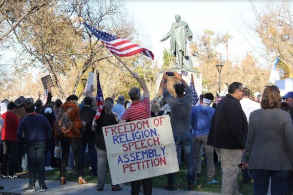 Rally attendees show support for Pastor Mike McClure near the Santa Clara Superior Court in San Jose, Calif., on Dec. 8, 2020. (The Epoch Times)