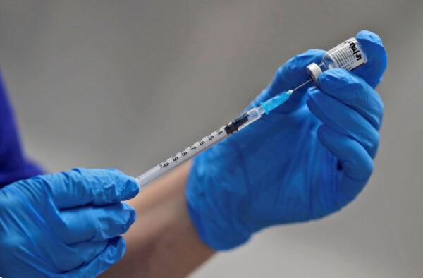 A nurse prepares to administer the Pfizer-BioNTech COVID-19 vaccine at Guy's Hospital in London on Dec. 8, 2020. (Frank Augstein/Pool via Reuters)