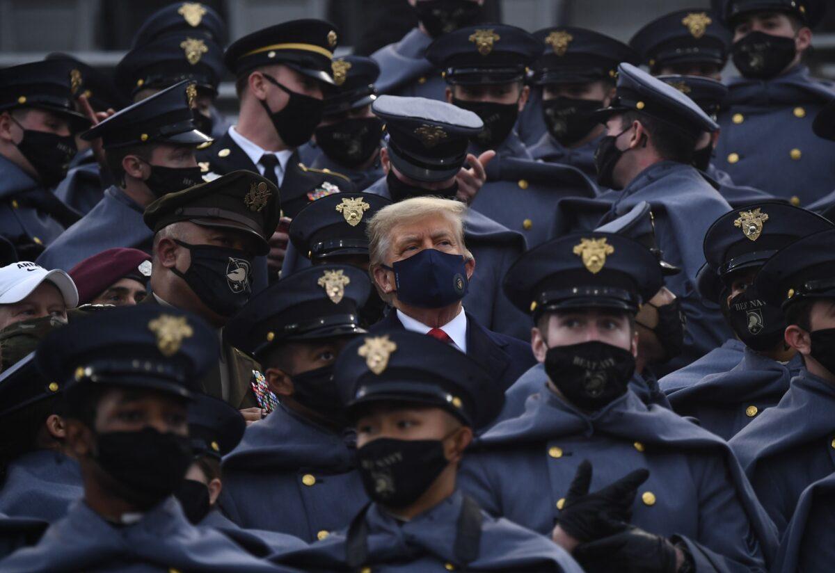 President Donald Trump joins West Point cadets during the Army-Navy football game at Michie Stadium in West Point, N.Y., on Dec. 12, 2020. (Brendan Smialowski/AFP via Getty Images)