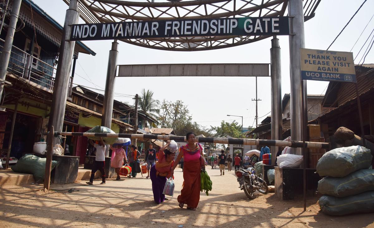People carry goods from Burma (also known as Myanmar) and enter India through the Indo–Myanmar Friendship Gate at Moreh, some 120 kilometers from Imphal, the capital city of Manipur state, on March 10, 2017. India and Burma share a 1,624-kilometer (1,009 miles)-long border. Border fencing isn't completed on the India–Burma border. (Biju Boro/AFP via Getty Images)
