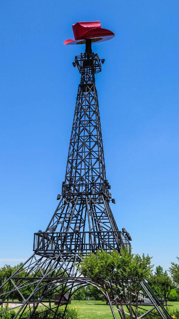 An Eiffel Tower with a cowboy hot on top of it welcomes visitors to Paris, Texas. (Courtesy of Jai Mo/Dreamstime.com)