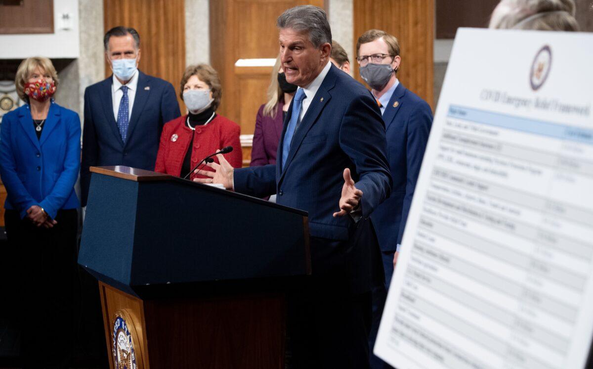 Sen. Joe Manchin (D-W.Va.) announces a bipartisan COVID-19 relief package, with other lawmakers including Sens. Lisa Murkowski (R-Alaska) and Mitt Romney (R-Utah), in Washington on Dec. 1, 2020. (Saul Loeb/AFP via Getty Images)