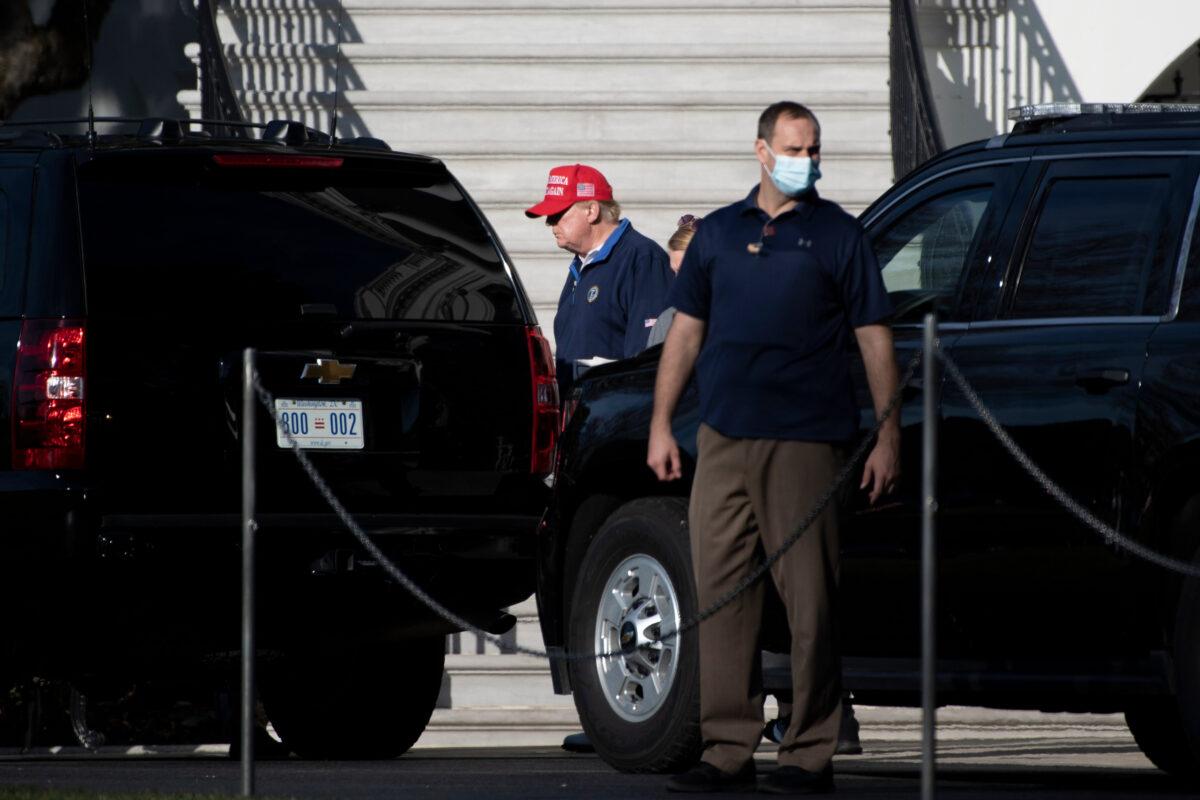 President Donald Trump walks to a motorcade before departing the White House in Washington to play golf, on Dec. 13, 2020. (Brendan Smialowski/AFP via Getty Images)