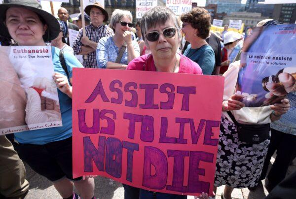 People rally against expansion to medically assisted dying legislation, during a protest in Ottawa on June 1, 2016. (Justin Tang/The Canadian Press)