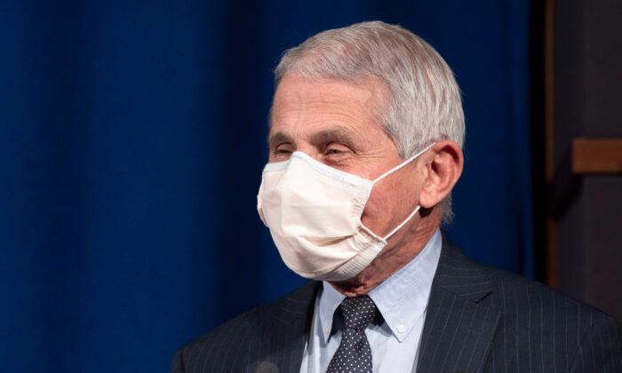 Fauci Says It’s ‘Possible’ Americans Still Need to Wear Masks in 2022