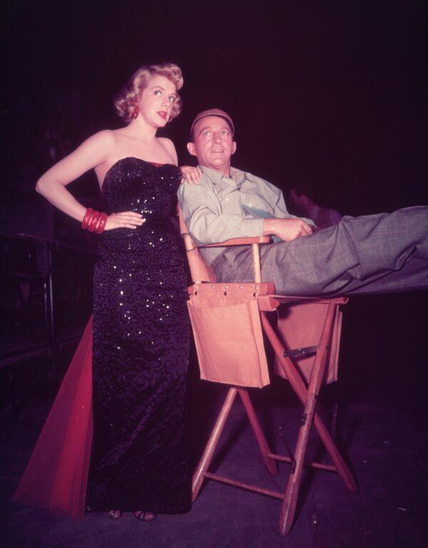 Singers and actors Rosemary Clooney (in costume) and Bing Crosby on the set of director Michael Curtiz’s “White Christmas.” (Hulton Archive/Getty Images)