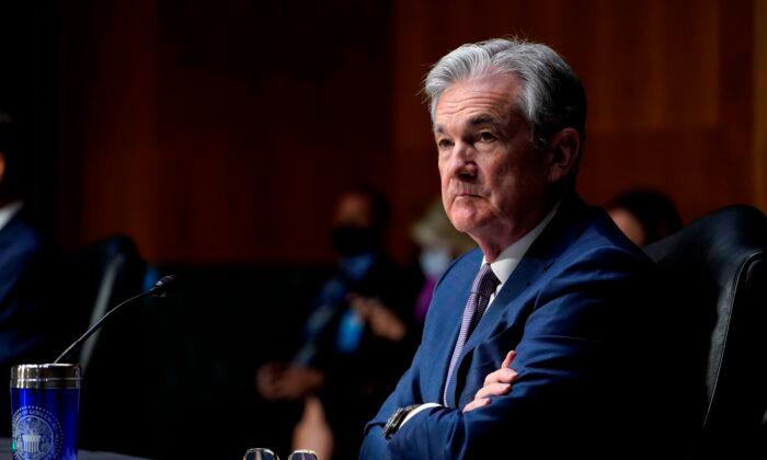 Fed Holds Interest Rates Near Zero, Boosts Economic Projections
