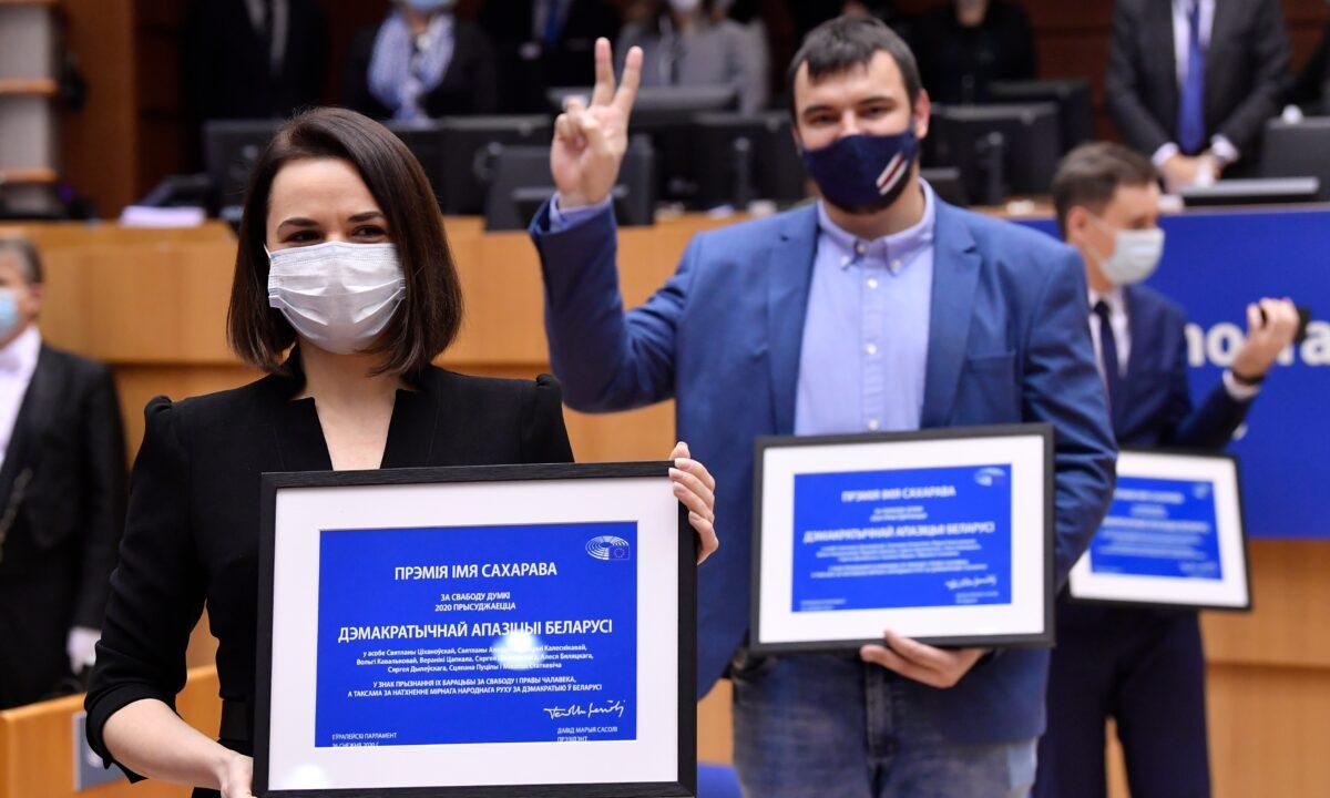 Belarus opposition leader Svetlana Tikhanovskaya poses among others with their prizes during the Sakharov Prize ceremony at the European Parliament in Brussels, on Dec. 16, 2020. (John Thys/Pool Photo via AP)