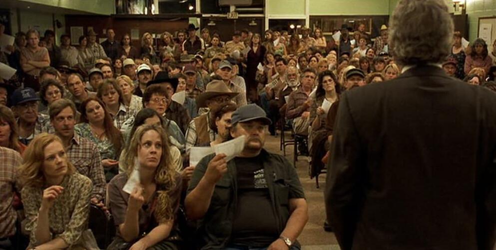 Lawyer Ed Masry (Albert Finney, R) addresses a meeting of plaintiffs regarding what they can expect in terms of medical compensation from the Pacific Gas and Electric Company in “Erin Brockovich.” (Universal Pictures)