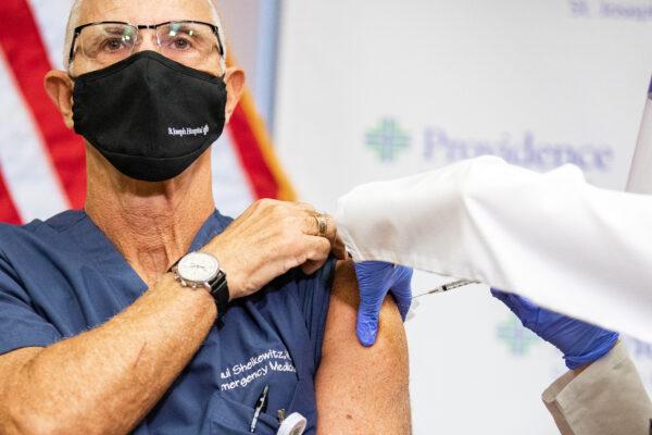 Dr. Paul Sheikewitz is the third person and the first doctor in Orange County to receive the Pfizer vaccine, at St. Joseph Hospital in Orange, Calif., on Dec. 16, 2020. (John Fredricks/The Epoch Times)