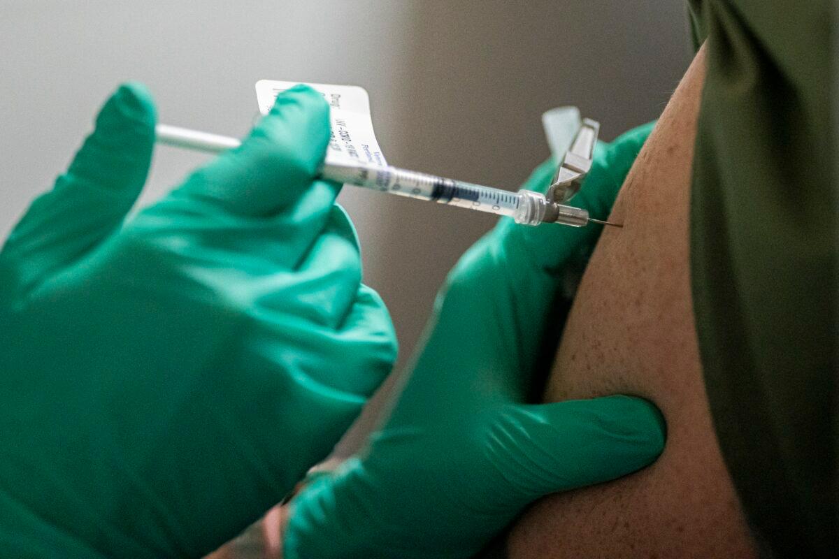 A person receives the COVID-19 vaccine in Portland, Ore., on Dec. 16, 2020. (Nathan Howard/Getty Images)
