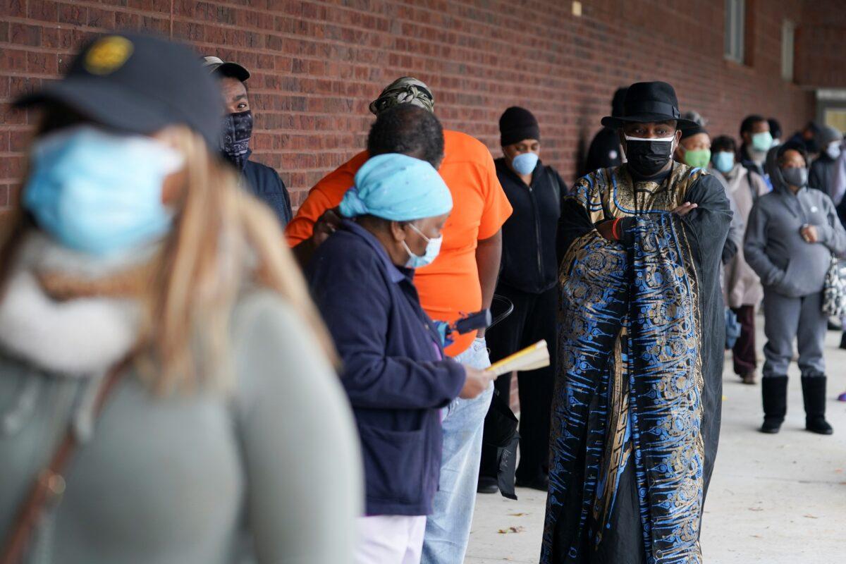 Early voters queue to cast their votes in two run-off elections that could determine control of the U.S. Senate, in Atlanta, on Dec. 14, 2020. (Elijah Nouvelage/Reuters)