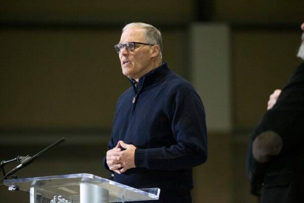 Washington State Governor Jay Inslee and other leaders speak to the press in Seattle, Wash., on March 28, 2020. (Karen Ducey/Getty Images)