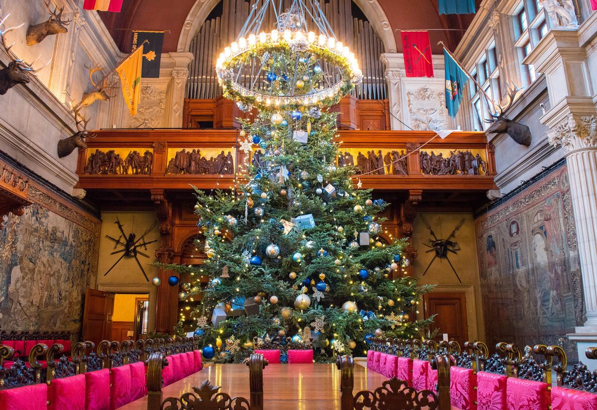 One of Biltmore’s most beloved holiday traditions is the raising of the 35-foot Fraser fir Christmas tree in the Grand Banquet Hall. (ExploreAsheville.com)