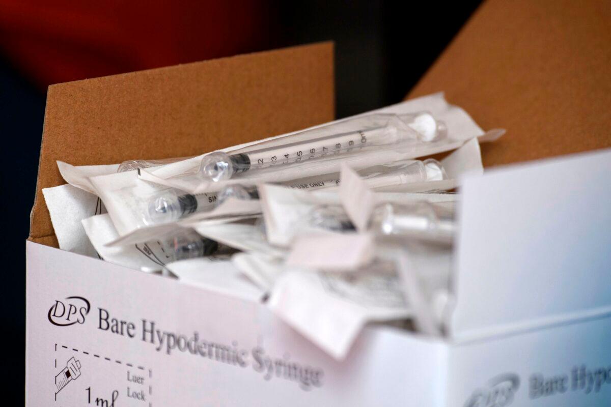 A box of syringes to be used to administer the Pfizer-BioNTech Covid-19 vaccine is seen in Reno, Nev., on Dec. 17, 2020. (Patrick T. Fallon/AFP via Getty Images)