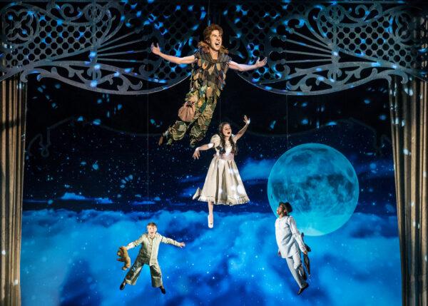 Peter Pan (Johnny Shea, top) leads the Darling siblings, (L–R) Carter Graf, Elizabeth Stenholt, and Cameron Goode, on a high-flying adventure to Neverland in “Peter Pan, A Musical Adventure,” streaming free on-demand for the holiday season. (Liz Lauren)