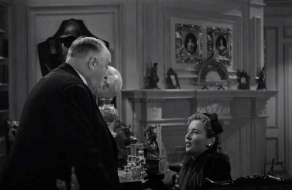 Magazine owner Alexander Yardley (Sydney Greenstreet) convinces his writer Elizabeth Lane (Barbara Stanwyck) to invite a sailor into her home for Christmas. (Warner Bros.)