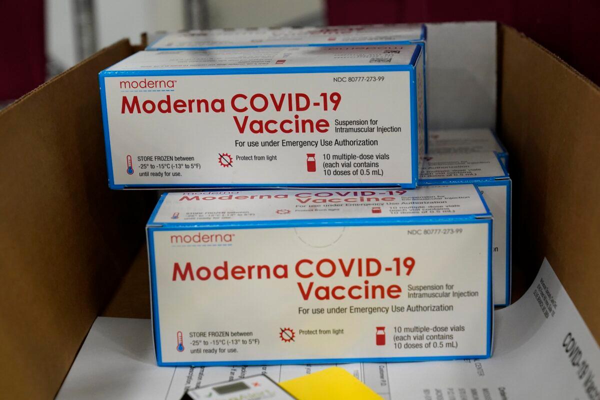 Boxes containing the Moderna COVID-19 vaccine are prepared to be shipped at the McKesson distribution center in Olive Branch, Miss., on Dec. 20, 2020. (Paul Sancya/AP Photo, Pool)