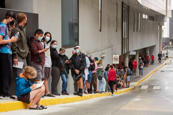 People waiting in long lines for Covid-19 tests at the Brookvale Centre in Sydney, Australia on Dec. 19, 2020. (Lee Hulsman/Getty Images)