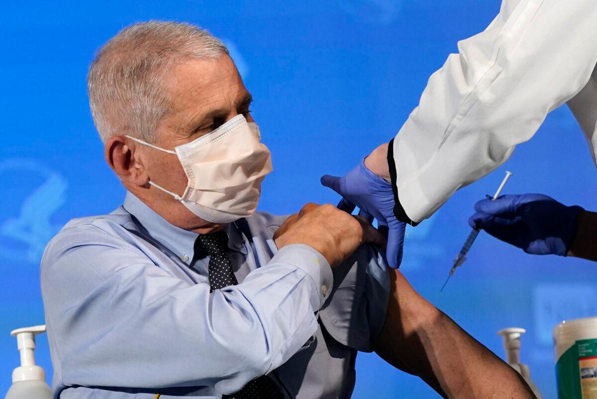 Dr. Anthony Fauci, director of the National Institute of Allergy and Infectious Diseases, receives a COVID-19 vaccine, at the National Institutes of Health in Bethesda, Md., on Dec. 22, 2020. (Patrick Semansky/Pool/AFP via Getty Images)