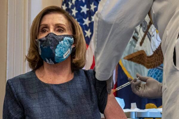 House Speaker Nancy Pelosi (D-Calif.) gets the COVID-19 vaccine in Washington on Dec. 18, 2020. (Ken Cedeno/Pool via AP)