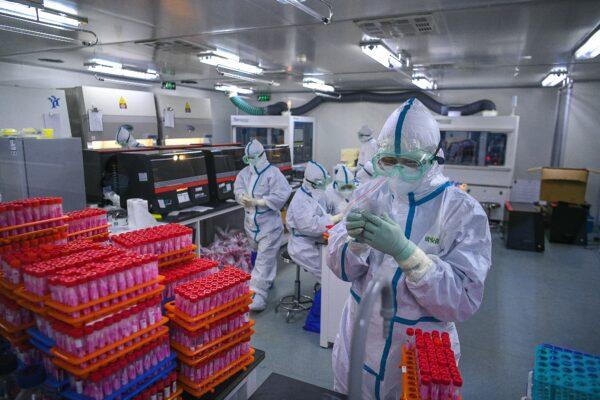 Technicians processing COVID-19 tests at a laboratory in Tianjin, China on Nov. 23, 2020. (STR/CNS/AFP via Getty Images)