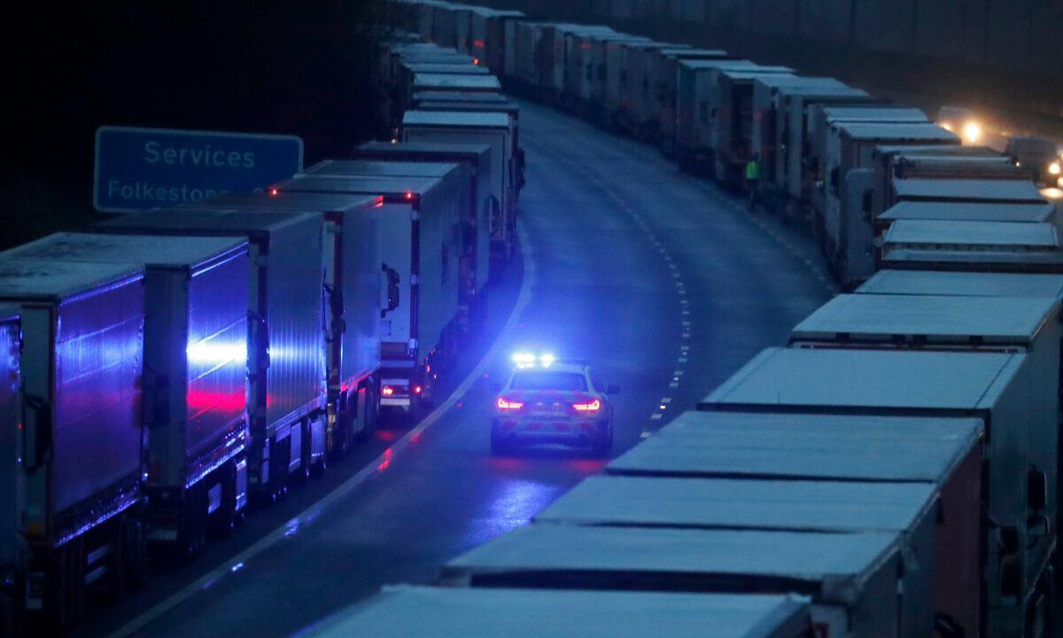 Lorries are parked on the M20 motorway as part of Operation Stack, while the Port of Dover remains closed, in southern England near the Channel Tunnel and Dover, on Dec. 23, 2020. (Frank Augstein/AP Photo)