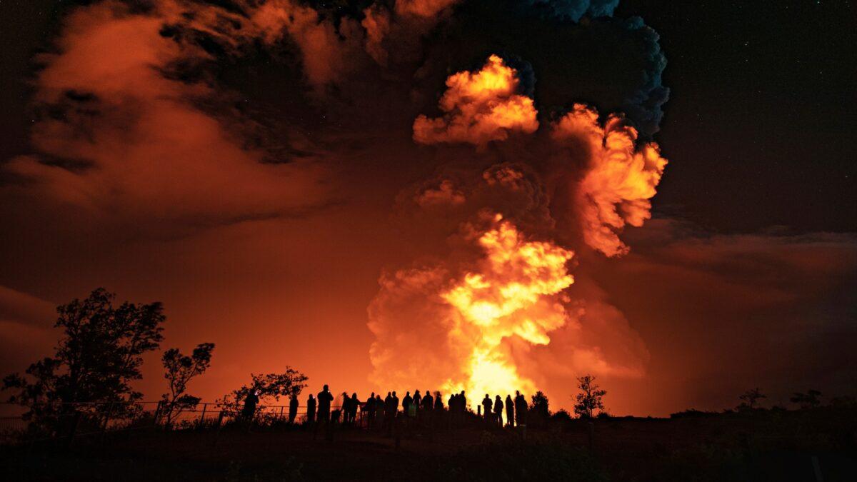 People watch an eruption from Kilauea volcano on the Big Island in Hawaii, on Dec. 20, 2020. (Janice Wei/National Park Service via AP)