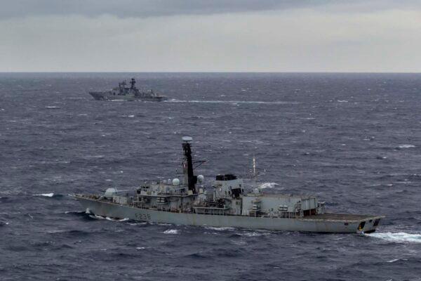 HMS Northumberland, a Royal Navy frigate, seen in the foreground, monitors the movements of the Vice-Admiral Kulakov, a Russian Udaloy-class destroyer, as she sailed northwest of the Outer Hebrides off the west coast of Scotland, in this photo released by the Royal Navy on Dec. 4, 2020. (Ministry of Defence)