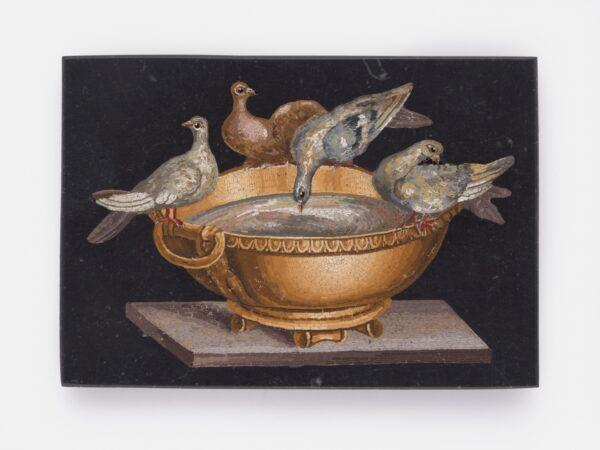 "Doves of Pliny," 19th century, by Gioacchino Barberi. Micromosaic reset in black plaque; 2 1/8 inches by 3 1/8 inches. Collection of Elizabeth Locke. (Travis Fullerton/Virginia Museum of Fine Arts)