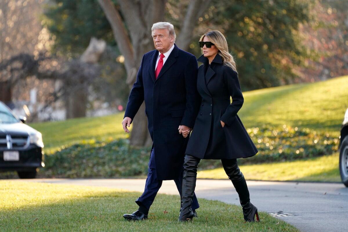 President Donald Trump and first lady Melania Trump walk to board Marine One on the South Lawn of the White House, in Washington, on Dec. 23, 2020. (AP Photo/Evan Vucci)