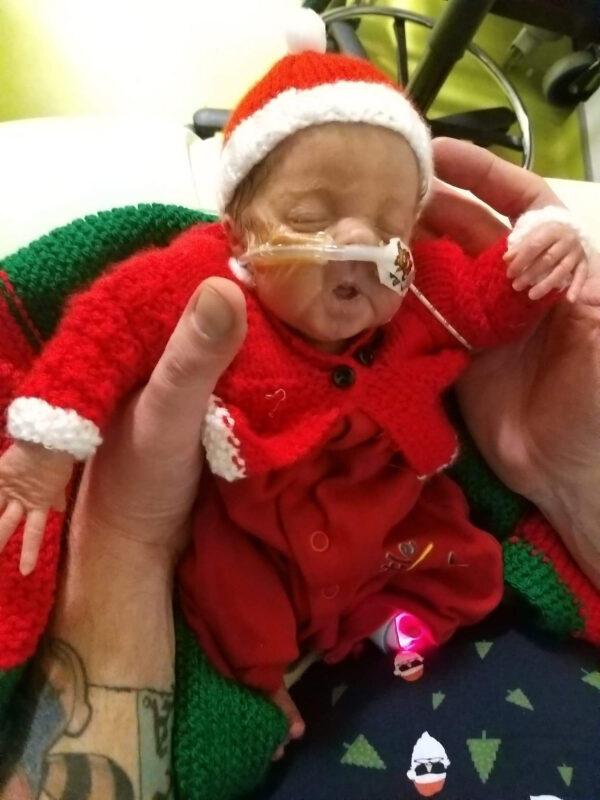 One-month-old Iris during Christmas in 2019. (Caters News)