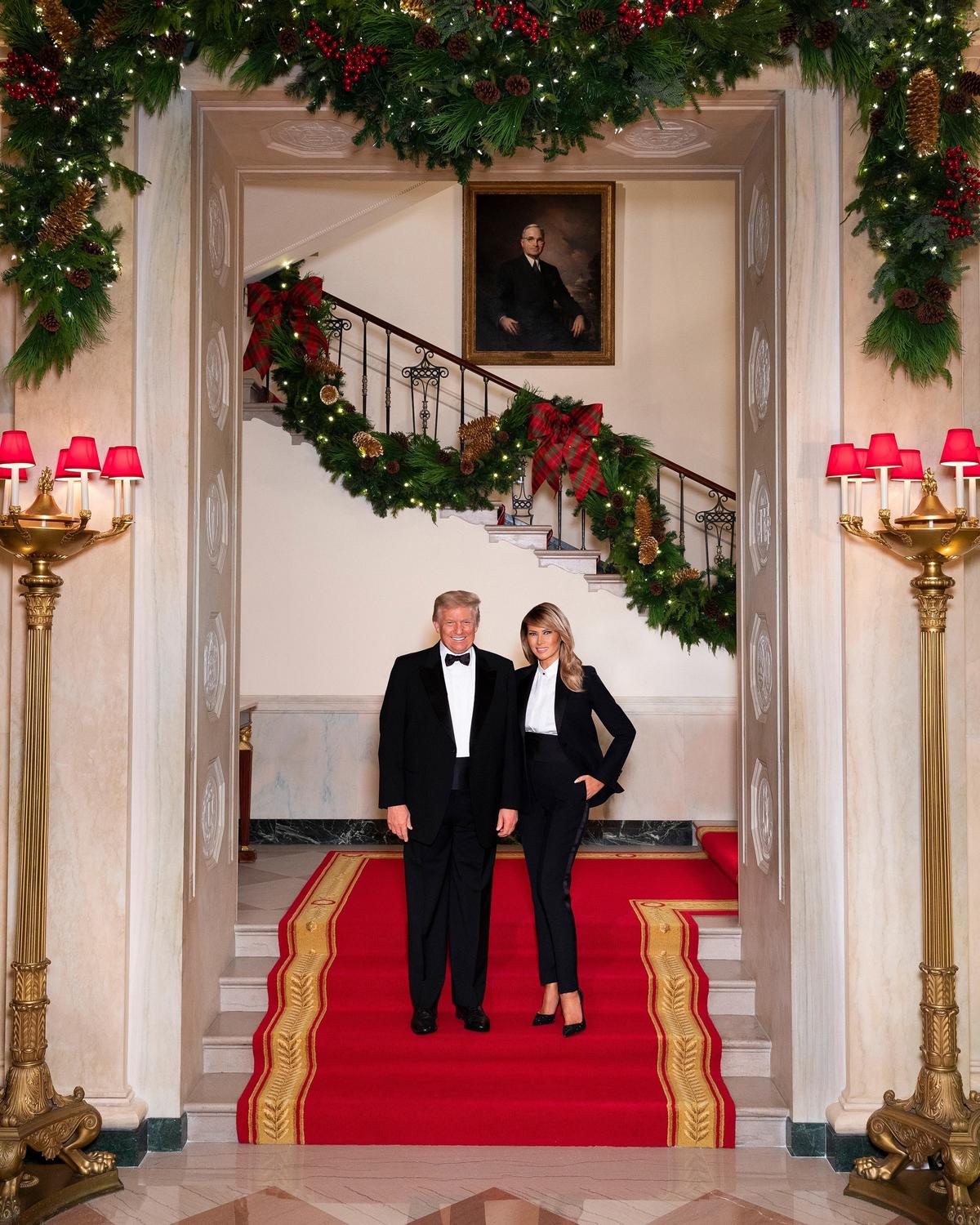President Donald J. Trump and First Lady Melania Trump pose for their official Christmas portrait on the Grand Staircase in the Grand Foyer of the White House on Dec. 10, 2020. (Official White House Photo by Andrea Hanks)