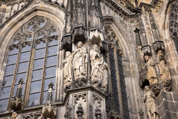 Stone figures on the façade of Aachen Cathedral. (Natalia Paklina/Shutterstock.com)